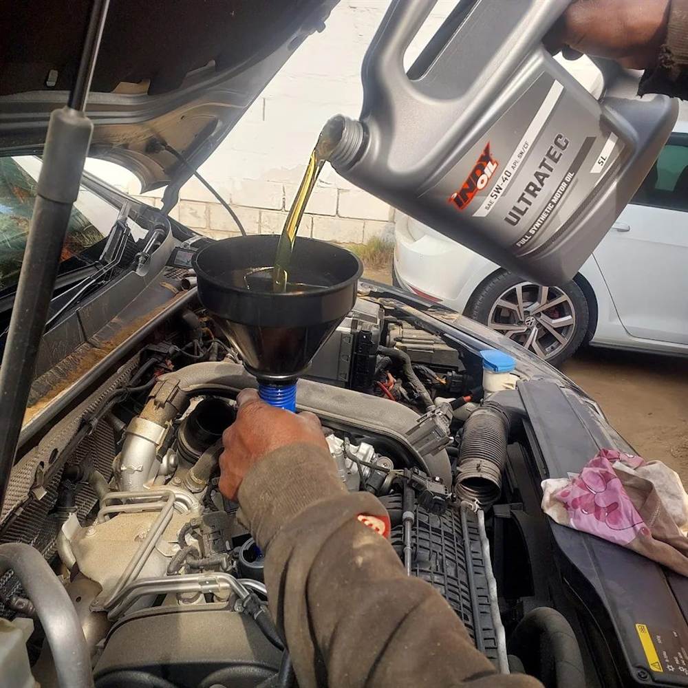 Nerved Mechanics technician working on a vehicle